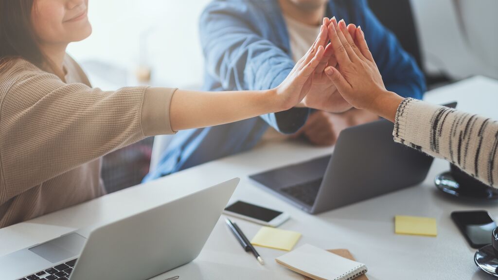 Group of businessman putting their hands together in the meeting